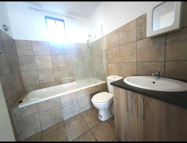 2 bed property to rent in ROOIHUISKRAAL NORTH